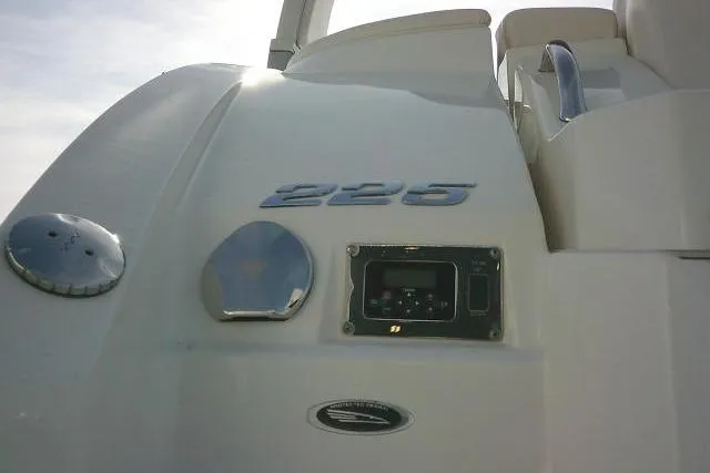 Slide: The Image of 2016 Chaparral 225 SSi boat rear view with model emblem and control panel. - 13