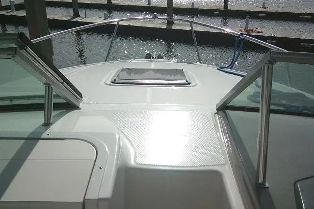 Slide: The Image of 2016 Chaparral 225 SSi boat deck with marina view. - 15