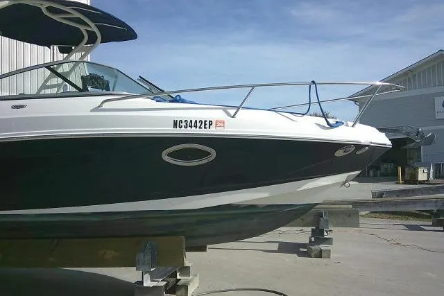 Slide: The Image of 2016 Chaparral 225 SSi boat on blocks, dockside view. - 2