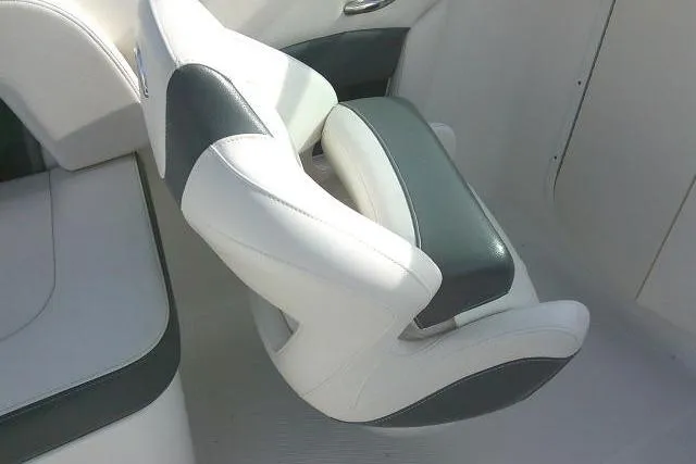 Slide: The Image of 2016 Chaparral 225 SSi boat seat, white and gray upholstery, modern design. - 26
