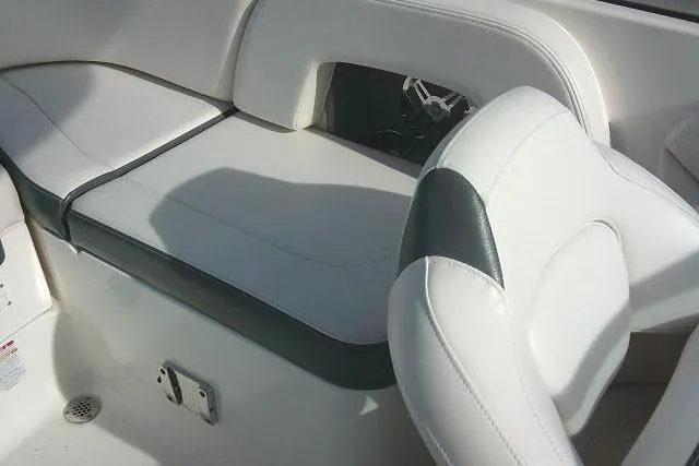 Slide: The Image of 2016 Chaparral 225 SSi boat interior with white and black seating. - 28