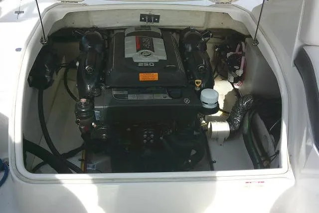 Slide: The Image of Engine compartment of 2016 Chaparral 225 SSi boat, showcasing the engine and components. - 30