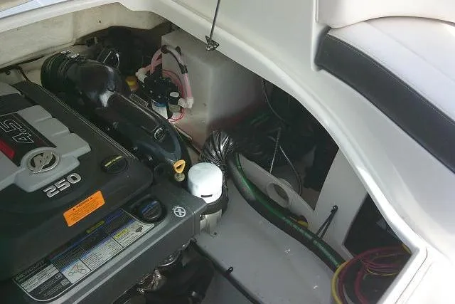 Slide: The Image of Engine compartment of 2016 Chaparral 225 SSi boat, showcasing a 250 horsepower engine. - 31