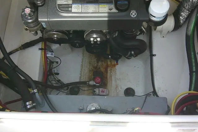 Slide: The Image of Engine compartment of 2016 Chaparral 225 SSi boat, showing mechanical components and wiring. - 32
