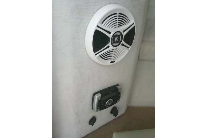 Slide: The Image of 2016 Chaparral 225 SSi boat interior with speaker and control panel. - 38