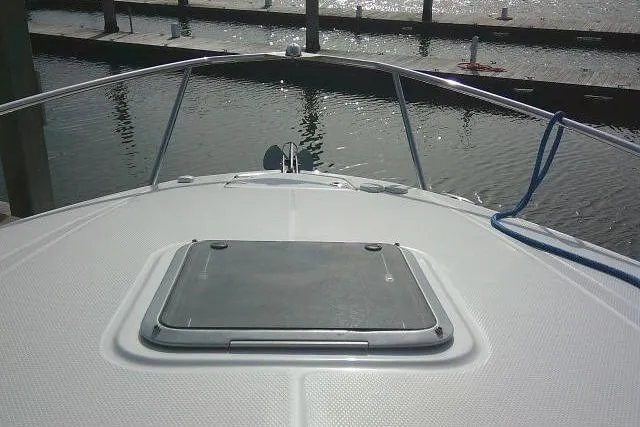 Slide: The Image of 2016 Chaparral 225 SSi boat bow view at marina dock. - 40