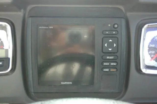 Slide: The Image of Garmin display on 2016 Chaparral 225 SSi boat dashboard, featuring control buttons. - 41