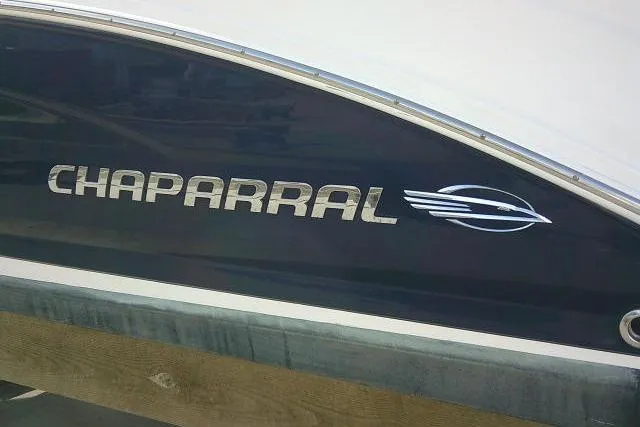 Slide: The Image of 2016 Chaparral 225 SSi boat logo on dark hull. - 5