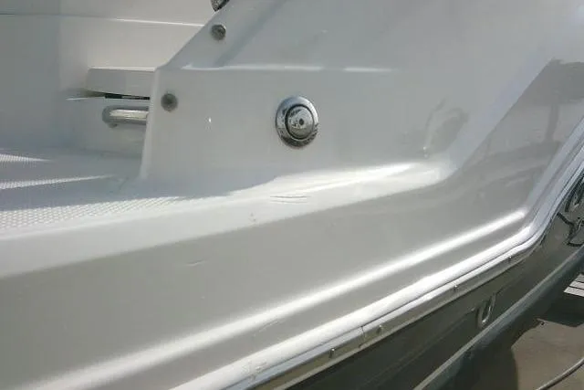 Slide: The Image of 2016 Chaparral 225 SSi boat exterior detail, showcasing sleek white hull design. - 53
