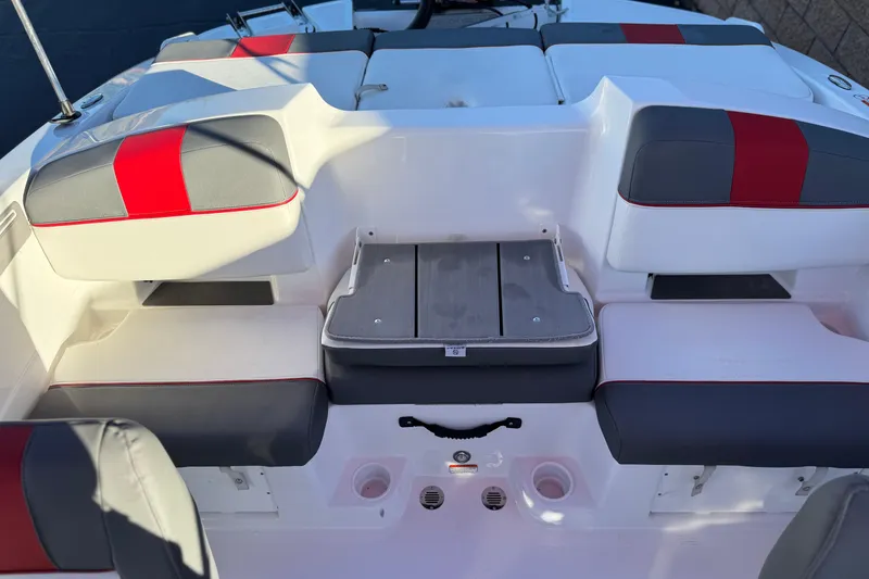 Slide: The Image of 2024 Tahoe T21 boat interior with red and gray seating, showcasing modern design. - 14