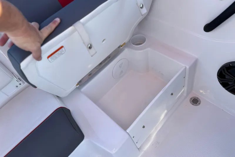 Slide: The Image of 2024 Tahoe T21 boat seat storage compartment with cup holder and speaker. - 15