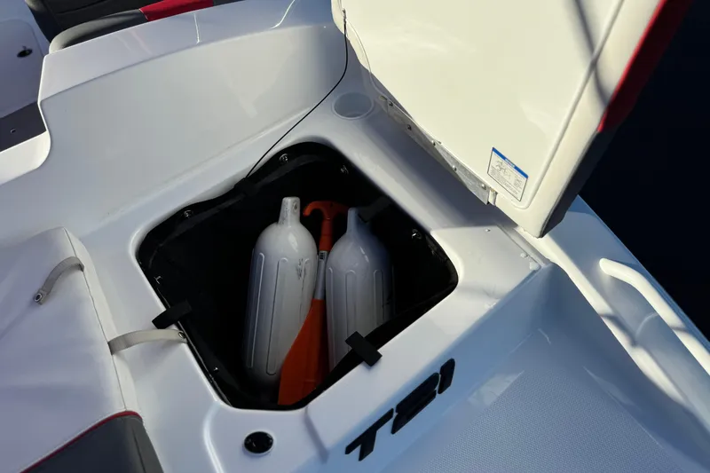 Slide: The Image of Open storage compartment on 2024 Tahoe T21 boat with fenders and equipment. - 6