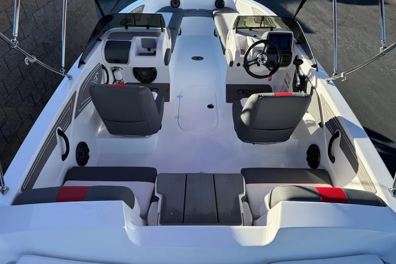 Slide: The Image of 2024 Tahoe T21 boat interior with seating, steering console, and modern design features. - 7