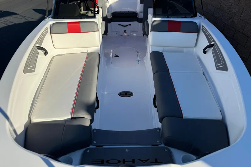 Slide: The Image of 2024 Tahoe T21 boat interior with gray and red cushioned seating. - 8