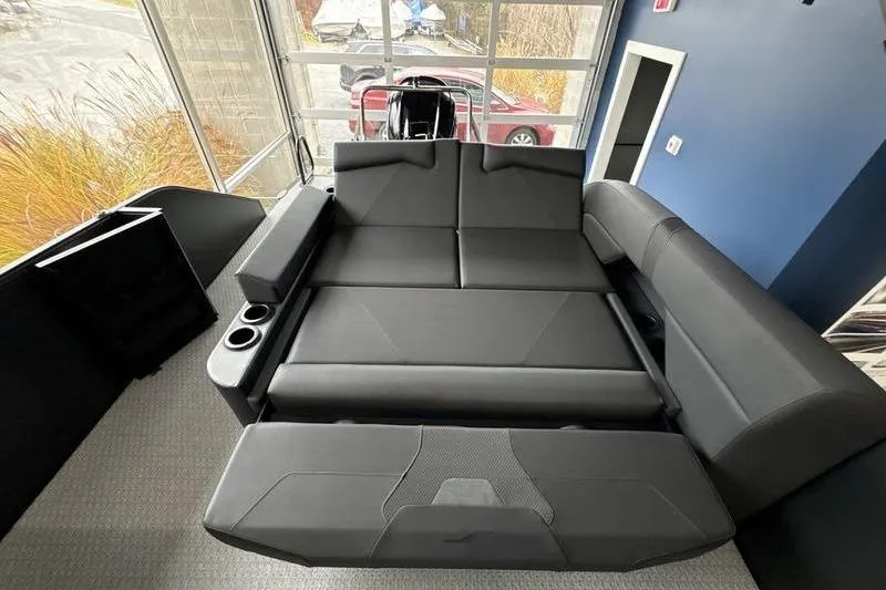 Slide: The Image of Luxurious black seating in 2026 Evotti 523CS boat interior, featuring cup holders and modern design. - 13