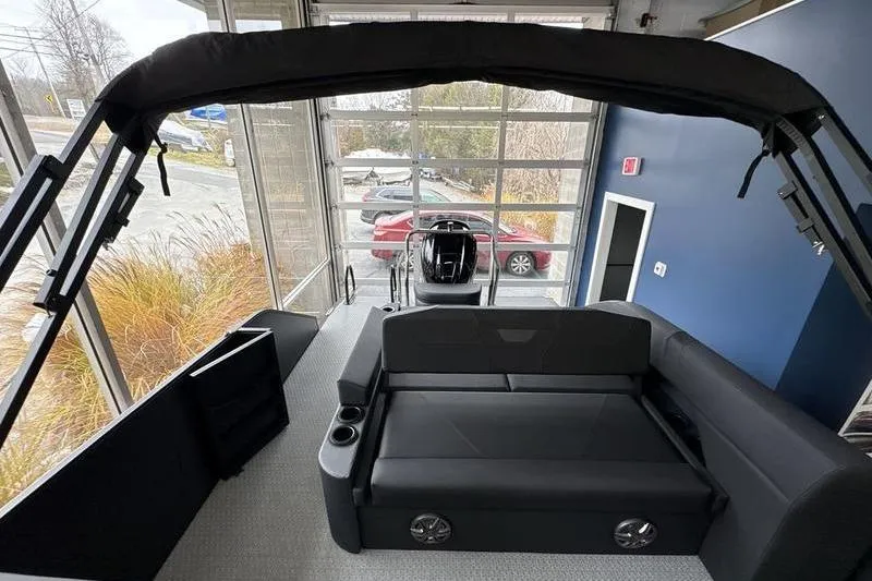 Slide: The Image of 2026 Evotti 523CS boat interior with sleek black seating and modern design. - 14