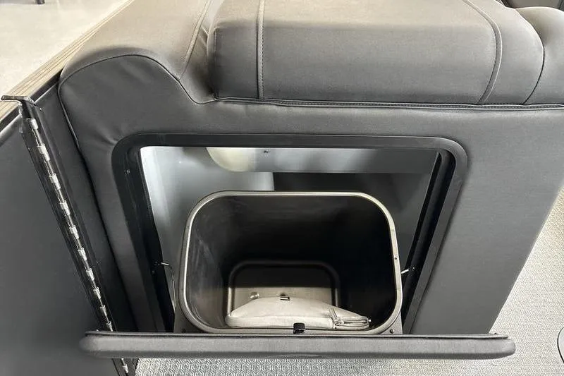 Slide: The Image of Evotti 523CS 2026 interior storage compartment with open lid and visible container. - 15