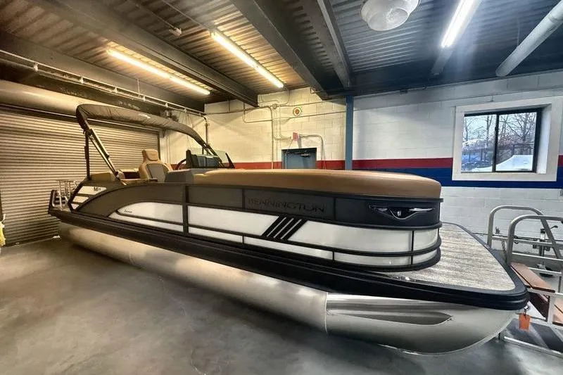 The Image of 2026 Bennington 24 MSL pontoon boat in a garage setting. - 0