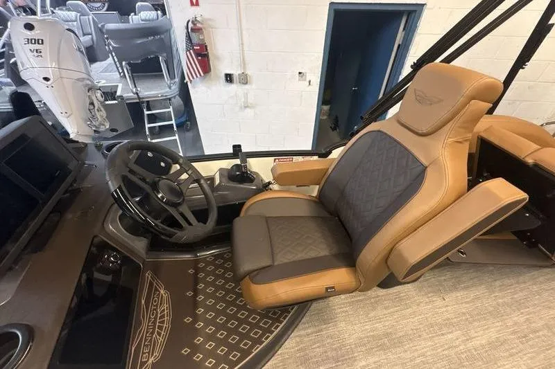 Slide: The Image of Captain's seat and helm of 2026 Bennington 24 MSL boat, featuring luxurious design and controls. - 12