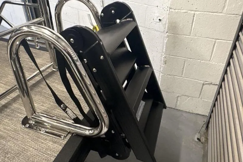 Slide: The Image of Stainless steel boat ladder on 2026 Bennington 24 MSL, folded and secured. - 19