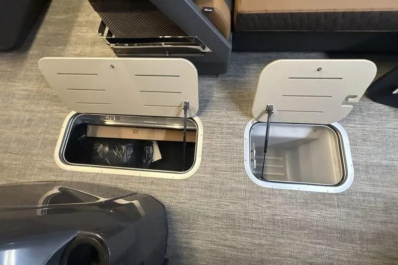 Slide: The Image of Under-seat storage compartments in a 2026 Bennington 24 MSL boat interior. - 20