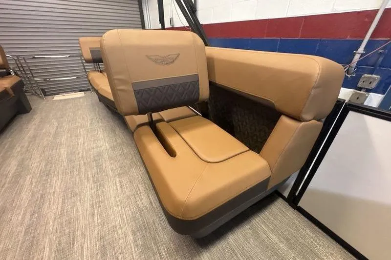 Slide: The Image of 2026 Bennington 24 MSL boat interior with tan leather seating and stylish design. - 9