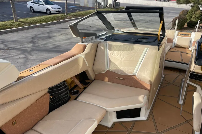 Slide: The Image of Interior of 2026 Nautique Super Air Nautique G25 Paragon boat, featuring luxurious seating. - 10