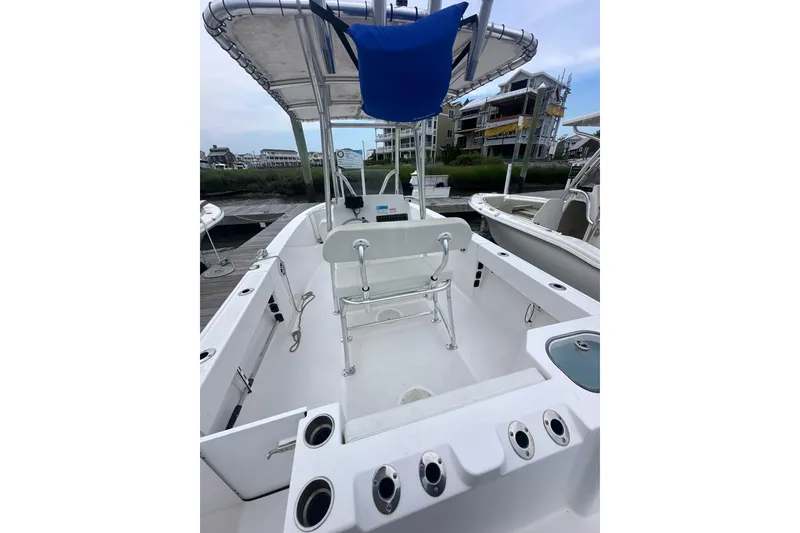 Slide: The Image of 2024 Aquasport 2200 Center Console boat with spacious deck and seating. - 5
