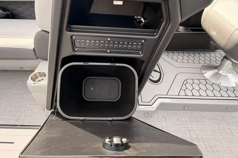 Slide: The Image of Interior of 2026 Veranda VR 235 VL boat showing storage compartment and seating area. - 10