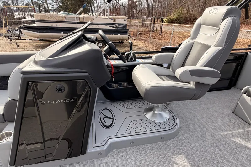 Slide: The Image of 2026 Veranda VR 235 VL boat interior with captain's chair and control console. - 11