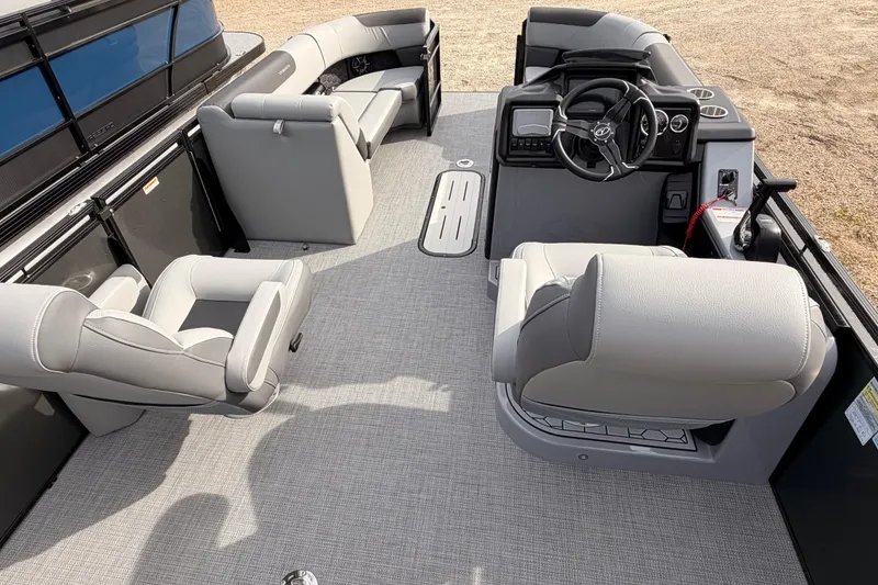 Slide: The Image of 2026 Veranda VR 235 VL pontoon boat interior with modern seating and steering console. - 6
