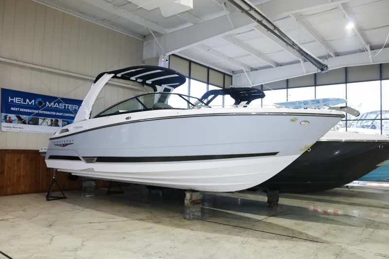 The Image of 2025 Monterey 278 Super Sport boat displayed in a showroom. - 0