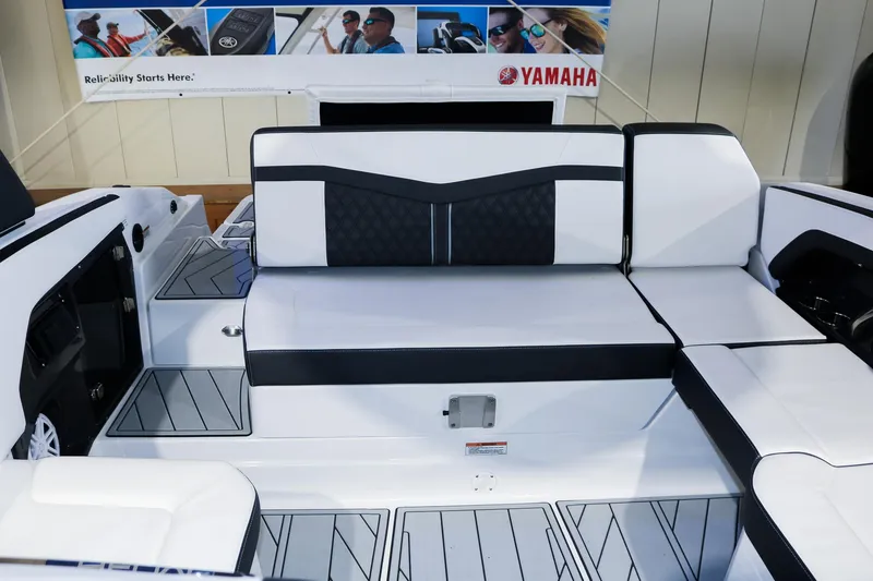 Slide: The Image of 2025 Monterey 278 Super Sport boat interior with Yamaha branding, featuring sleek white seating. - 14