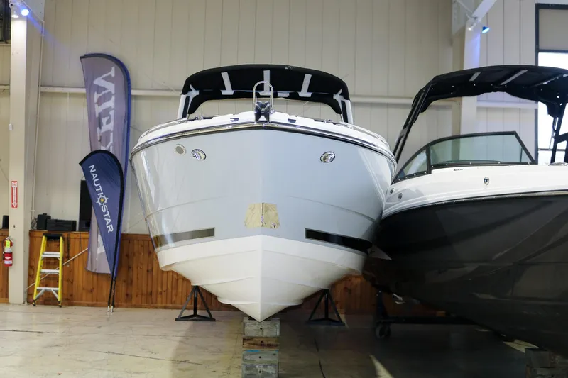 Slide: The Image of 2025 Monterey 278 Super Sport boat displayed indoors, front view. - 3