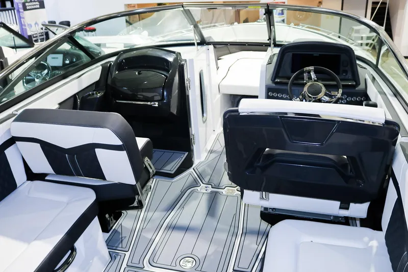 Slide: The Image of Interior of 2025 Monterey 278 Super Sport boat with modern seating and dashboard. - 5