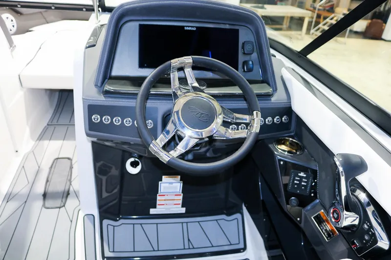 Slide: The Image of 2025 Monterey 278 Super Sport boat dashboard with modern steering wheel and controls. - 9