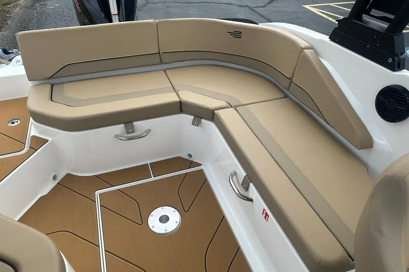 Slide: The Image of 2026 Bayliner V20 boat interior with tan seating and sleek design. - 16