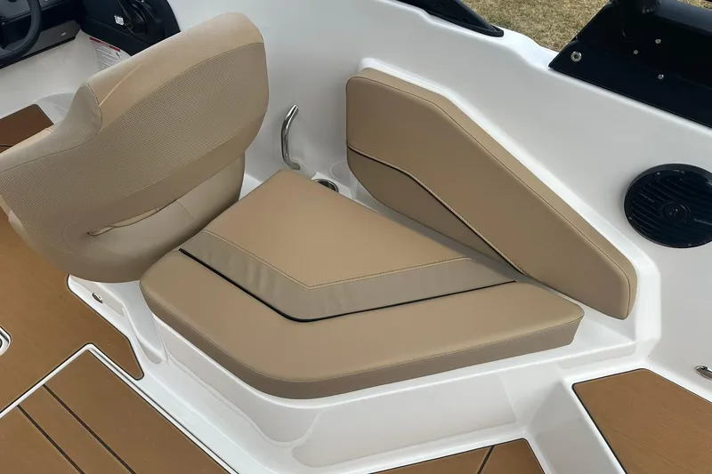 Slide: The Image of 2026 Bayliner V20 boat interior with beige seating and modern design. - 22