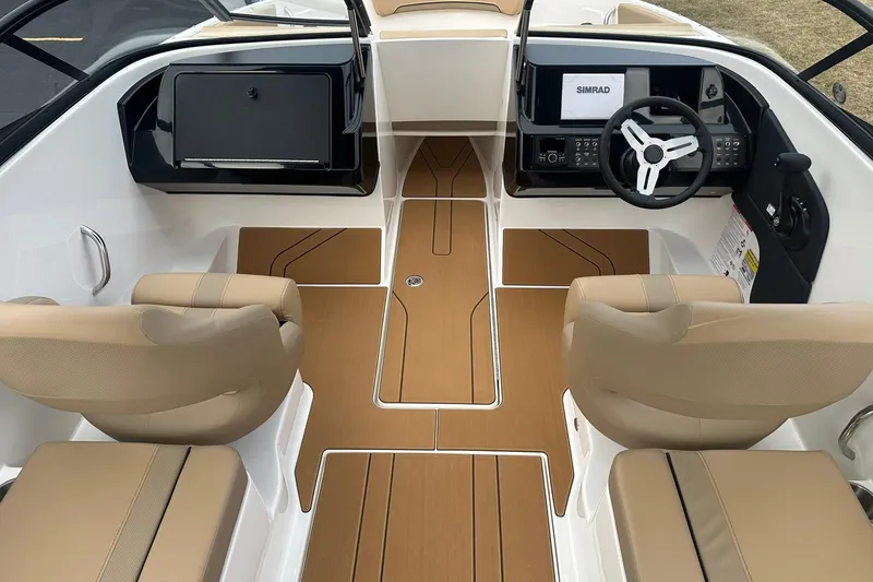 Slide: The Image of 2026 Bayliner V20 boat interior with beige seats and modern dashboard. - 6