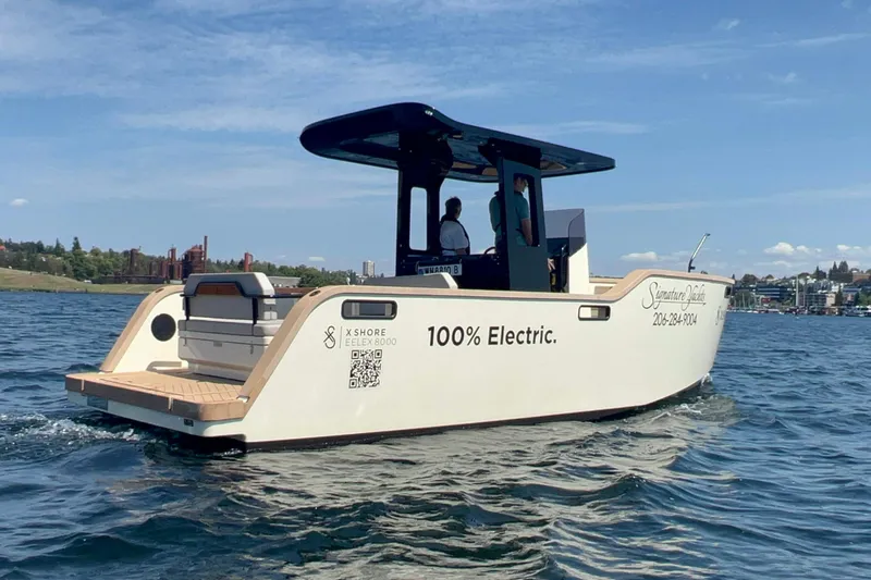 Slide: The Image of 2023 X Shore Eelex 8000 electric boat cruising on a sunny day. - 1