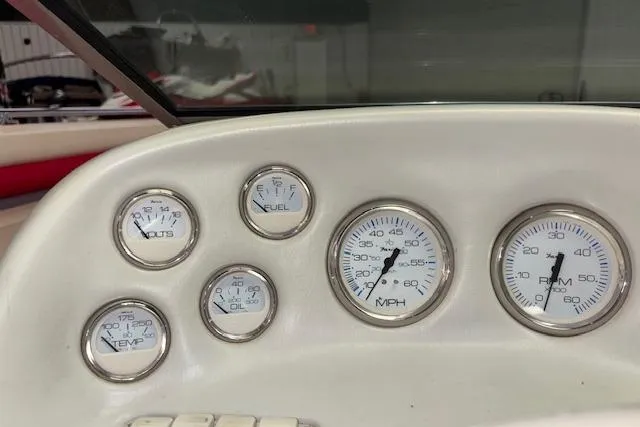 Slide: The Image of Dashboard of a 1995 Crownline 180 BR boat with various gauges. - 18