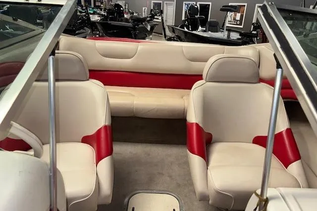 Slide: The Image of Interior of a 1995 Crownline 180 BR boat with red and white seating. - 23