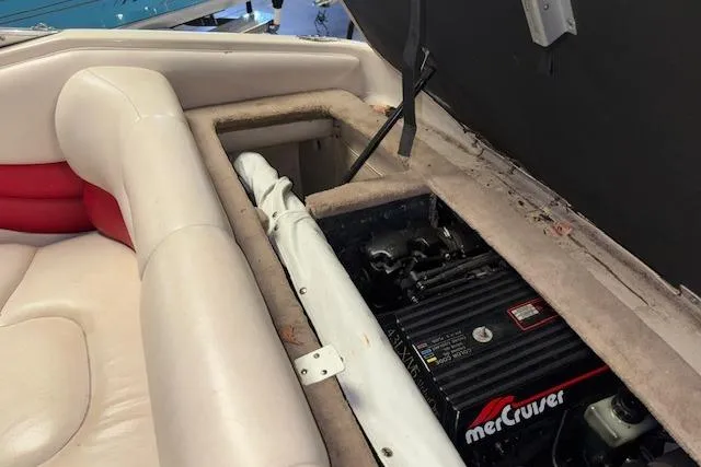 Slide: The Image of 1995 Crownline 180 BR boat interior with MerCruiser engine visible. - 29