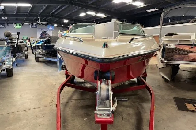 Slide: The Image of 1995 Crownline 180 BR boat on trailer in indoor showroom. - 3