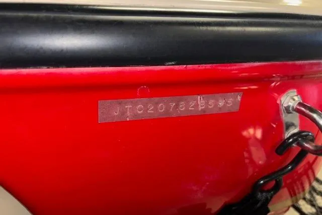 Slide: The Image of 1995 Crownline 180 BR boat hull identification number (HIN) on red surface. - 34
