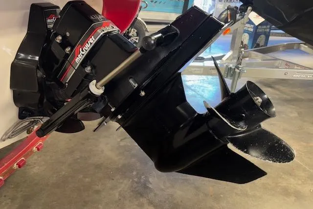 Slide: The Image of 1995 Crownline 180 BR boat with a Mercury outboard motor in a garage setting. - 9