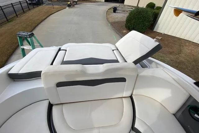 Slide: The Image of 2013 Chaparral 226 SSi boat interior with white seating and adjustable backrests. - 10