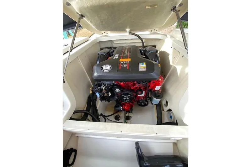 Slide: The Image of 2013 Chaparral 226 SSi boat engine compartment with V8 engine visible. - 11
