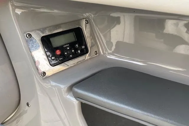 Slide: The Image of Control panel on 2013 Chaparral 226 SSi boat dashboard, featuring a digital display. - 13