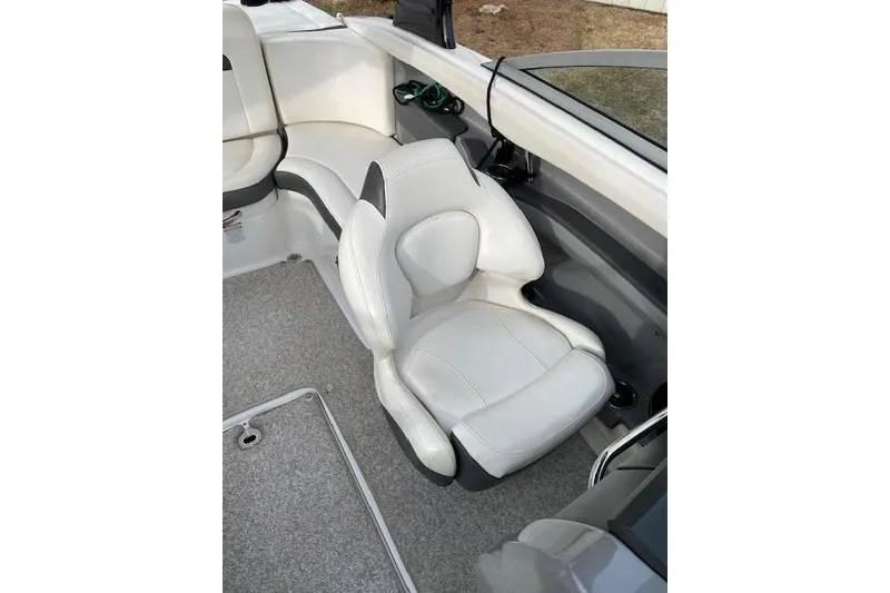 Slide: The Image of White leather seating in a 2013 Chaparral 226 SSi boat interior. - 7